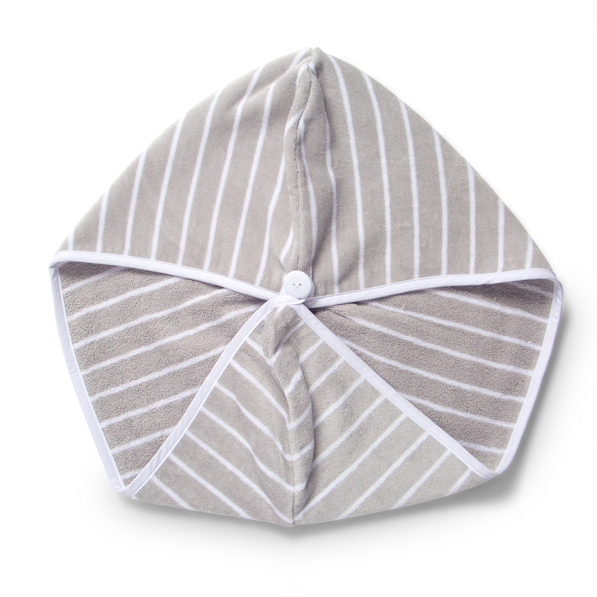 Flat lay of grey and white stripe hair towel with white button