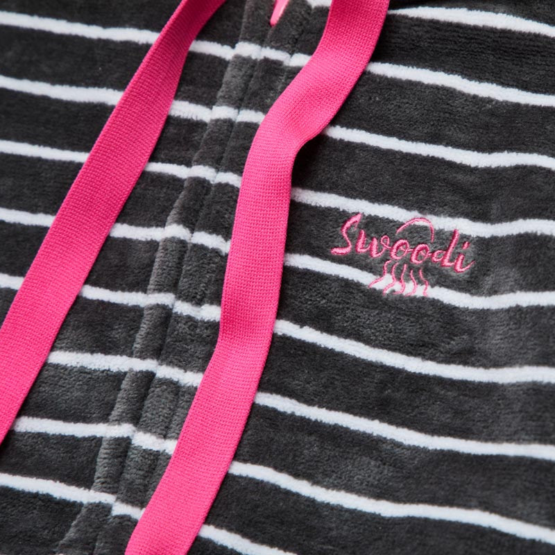 Close up of Charcoal and white stripe hooded towel with pink trims 