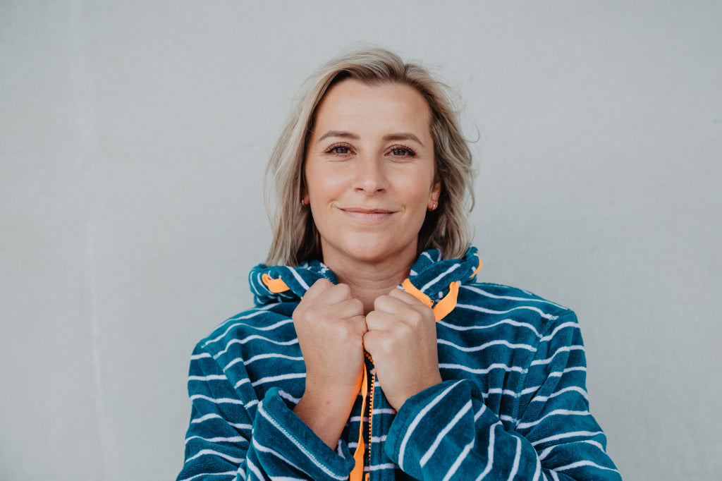 Close up of lady wearing turquoise with orange swim robe 