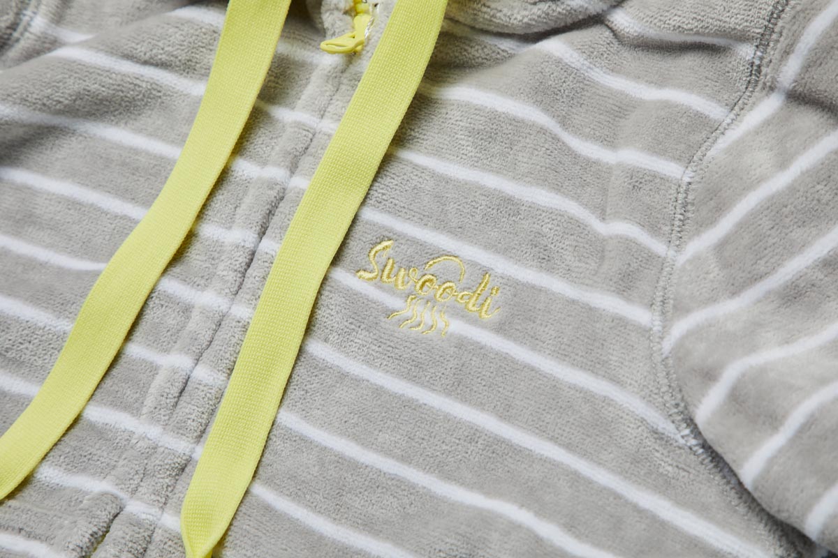Close up of kids beach gown in grey with lemon trim 