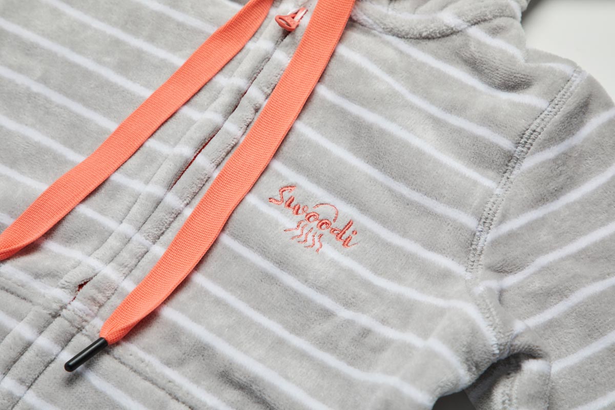 Close up of toddler zip up beach towel in grey with coral trims 