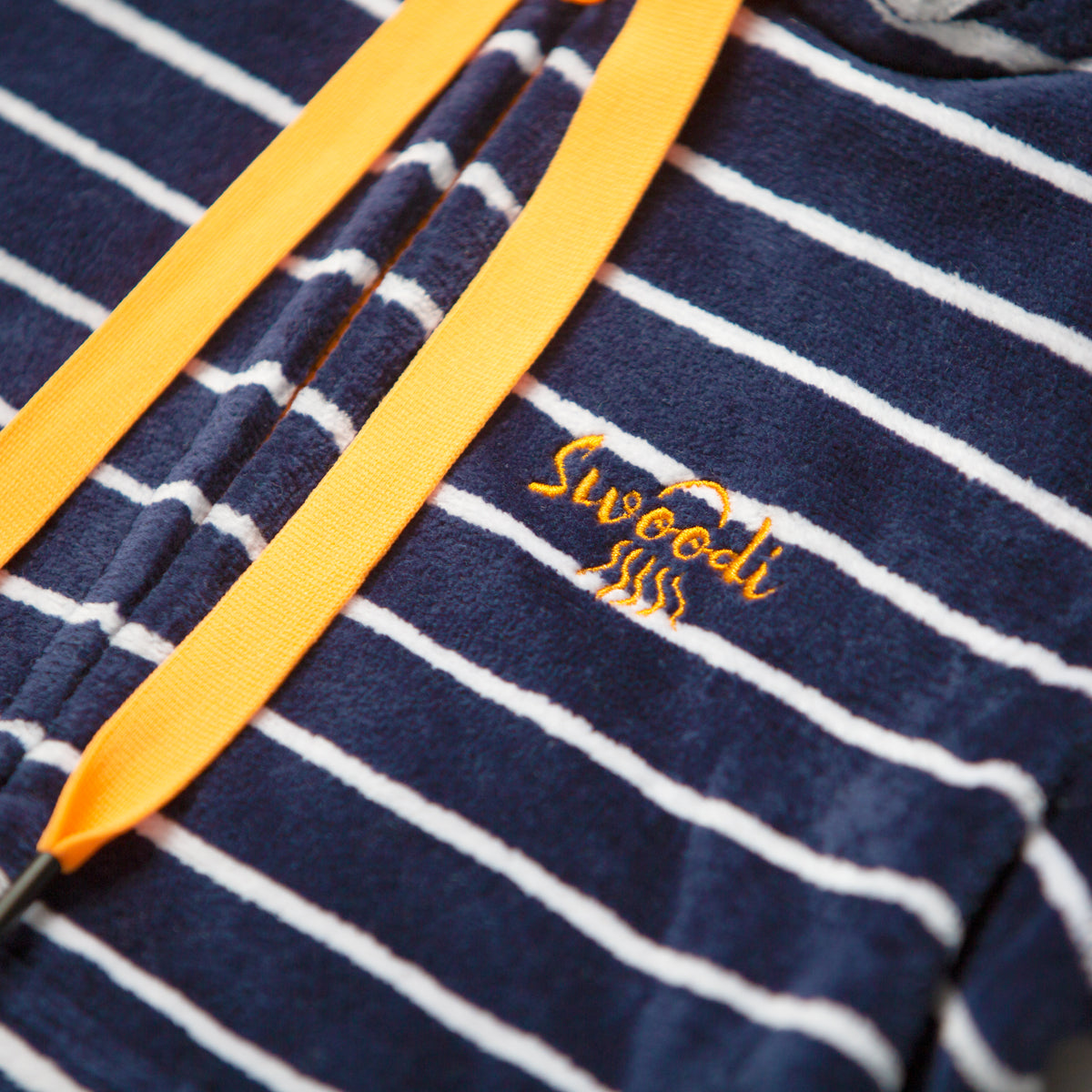 close up of hooded swim towel with navy and citrus trims
