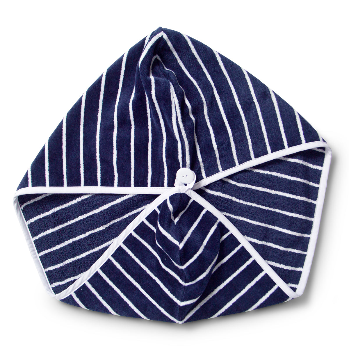 Flat lay of hair wrap in toweling fabric in navy and white, joined together with white button 